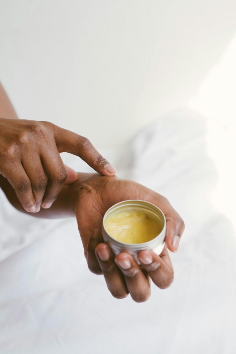 Effective Blog Promotion: Strategies to Increase Your Reach 6 Close-up of a hand applying natural skincare cream, emphasizing self-care and holistic health.
